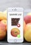 Phone with shopping list healthy vs unhealthy chocolat apple diet