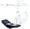 Phone splashing into water - high key