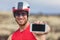 Phone sport app triathlon man biking road bike- triathlete using smartphone maps apps during cycling. Fit male cyclist