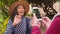 Phone, travel and photograph with a senior woman tourist posing for a picture on a mobile while having fun outside