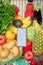 phone with white screen copy space in grocery shopping cart with fruits and vegetables