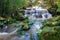 Phonpob waterfall, beautiful waterfall in a forest filled with green trees at Phu Kradung National Park in the rainy season,