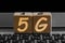 Photo on 5G network theme. wooden cubes with the acronym `5G`, on the background of laptop