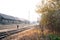 Photo of abandoned rails and a railway station