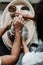 Photo from above. Male and female hands in a pottery workshop make vases from clay