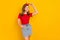 Photo of adorable charming cheerful positive little woman posing on camera isolated on yellow color background