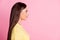 Photo of adorable charming young lady wear casual yellow outfit looking empty space  pastel pink color