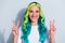 Photo of adorable cute vibrant gradient hair girl dressed t-shirt smiling showing two v-signs isolated white color