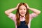 Photo of adorable little ginger school child in front of blackboard arms foxy head glad to see classmates 1 september