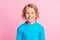 Photo of adorable little kid toothy beaming smiling wear blue turtleneck  pastel pink color background