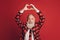 Photo of affectionate retired old man show heart shape raise hands wear heart print tux tie isolated red background