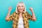 Photo of aged lady rejoice luck fists hands triumph awesome isolated over turquoise color background