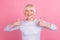 Photo of aged lady show thumb-up great promo recommend choose advert isolated over pink color background
