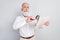 Photo of aged man pensioner read newspaper news loupe magnifier research isolated over grey color background