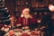 Photo of aged santa claus happy positive smile drink milk eat cookies workshop eve time midnight atmosphere magic