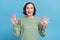 Photo of aged white hair hooray lady wear green jumper isolated on blue color background