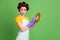 Photo of amazed cute girl wash plate sponger violet latex gloves impressed wear hair rollers vintage skirt isolated over