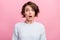 Photo of amazed shocked young woman afraid scared problem bad mood astonished isolated on pink color background