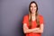 Photo of amazing attractive business lady with crossed hands toothy smiling responsible person wear casual orange t