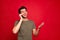 Photo of amazing guy speaking over telephone with foreign friends casual outfit isolated on red background