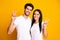 Photo of amazing marriage pair showing v-sign symbols wear casual outfit isolated yellow color background