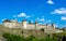 Photo of ancient stone castle with many hight towers in Kamyanets-Podilsky