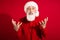 Photo of angry aggressive santa claus have employment conflict wear x-mas hat suit on red color background