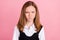Photo of angry beautiful school girl wear black white uniform bloated cheeks isolated pink color background