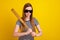 Photo of angry young woman hold hands baseball bat fight game match isolated on yellow color background