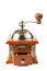 Photo of an antique coffee grinder on white