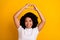 Photo of appreciative woman with perming coiffure dressed white t-shirt showing heart over head isolated on yellow color