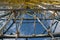 Photo of Architectural details of the metallic structure of a big ferris wheel. Old, rustic carousel details for web or