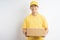 Photo of asian courier holding parcel on white background