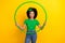 Photo of astonished lovely girl hold training hula hoop unbelievable reaction isolated on yellow color background