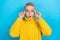 Photo of astonished pretty lady wear yellow cozy pullover new glasses impressed quality low prices isolated on blue