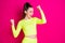 Photo of astonished pretty young woman stand fists up yell dress sport suit isolated on vibrant shine pink color