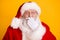 Photo of astonished santa claus impressed stare stupor x-mas atmosphere fairy magic close cover face lips hand wear red