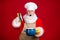 Photo of astonished santa claus open saucepan pot cover x-mas tradition dinner cooking wear chef cap red costume apron