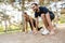 Photo of athletic happy couple doing exercises while working out