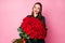 Photo of attractive charming fancy lady red bright lipstick hold large roses bouquet boyfriend 8 march present surprise