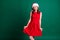 Photo of attractive coquettish lady ready for newyear corporate party 2021 midnight season wear santa cap red mini dress