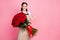 Photo of attractive friendly floral shop assistant lady cheerful mood hold one hundred roses bunch low price open arm