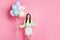 Photo of attractive funny lady birthday party best friend guest bring carry many air balloons surprise wear casual green