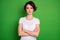 Photo of attractive lady short wavy hairdo arms crossed strict bossy person not smiling intelligent wear casual white t