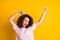 Photo of attractive young crazy curly brown girl dance on party  over yellow color background