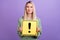 Photo of attractive young lady good mood dangerous exclamation mark isolated over purple color background