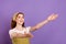 Photo of attractive young nice woman open hands welcome empty space isolated on purple color background