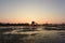 Photo Backlight Silhouette Southeast Asian wetland huts