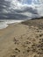 Photo of a a beach scene with moody sky