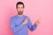 Photo of beard cool guy show empty space wear blue sweater isolated on pastel pink color background